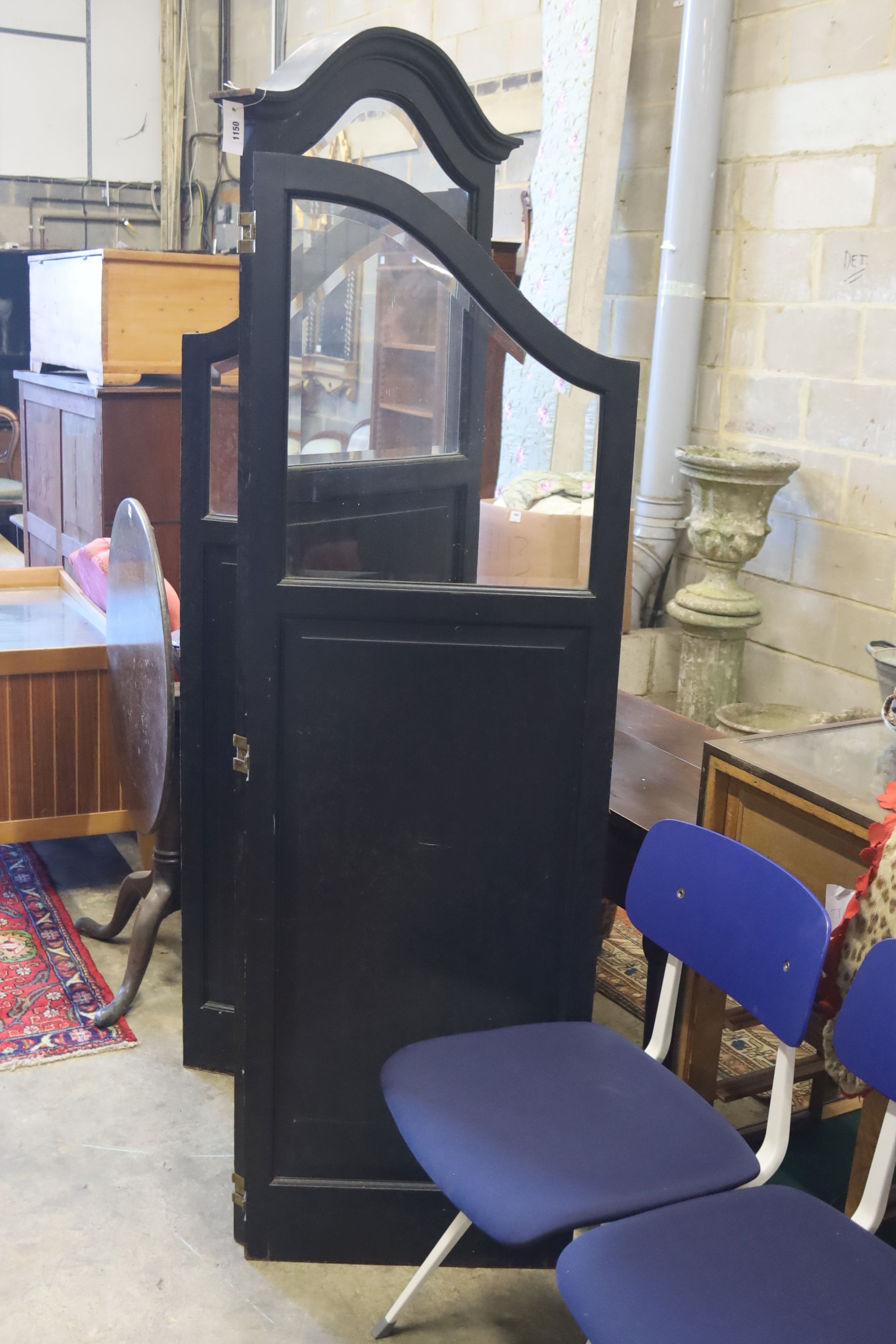 An early 20th century glazed and ebonised oak three fold dressing screen, height 192cm